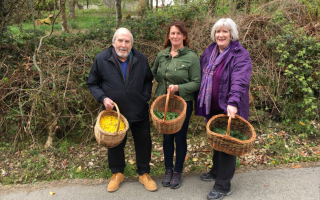 Glendalough visit to gin distillery 3 people with baskets of garnishes in Ireland