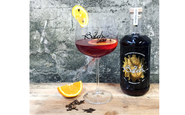 Whinberry gin winter warmer cocktail with orange and cloves