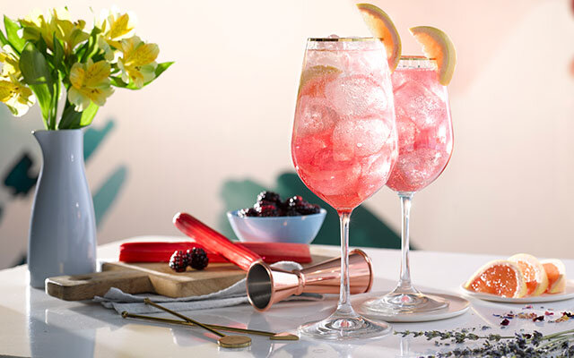 Craft Gin Clubbers receive a bespoke bottle of cocktail syrup to make every Cocktail of the Month, including April 2021’s Pink Gin Spritz (pictured here)