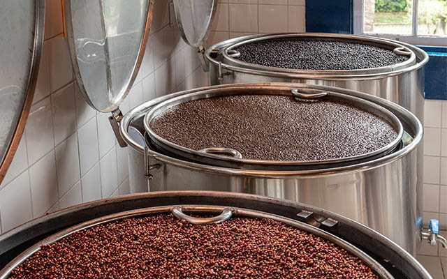Botanicals being macerated before distillation
