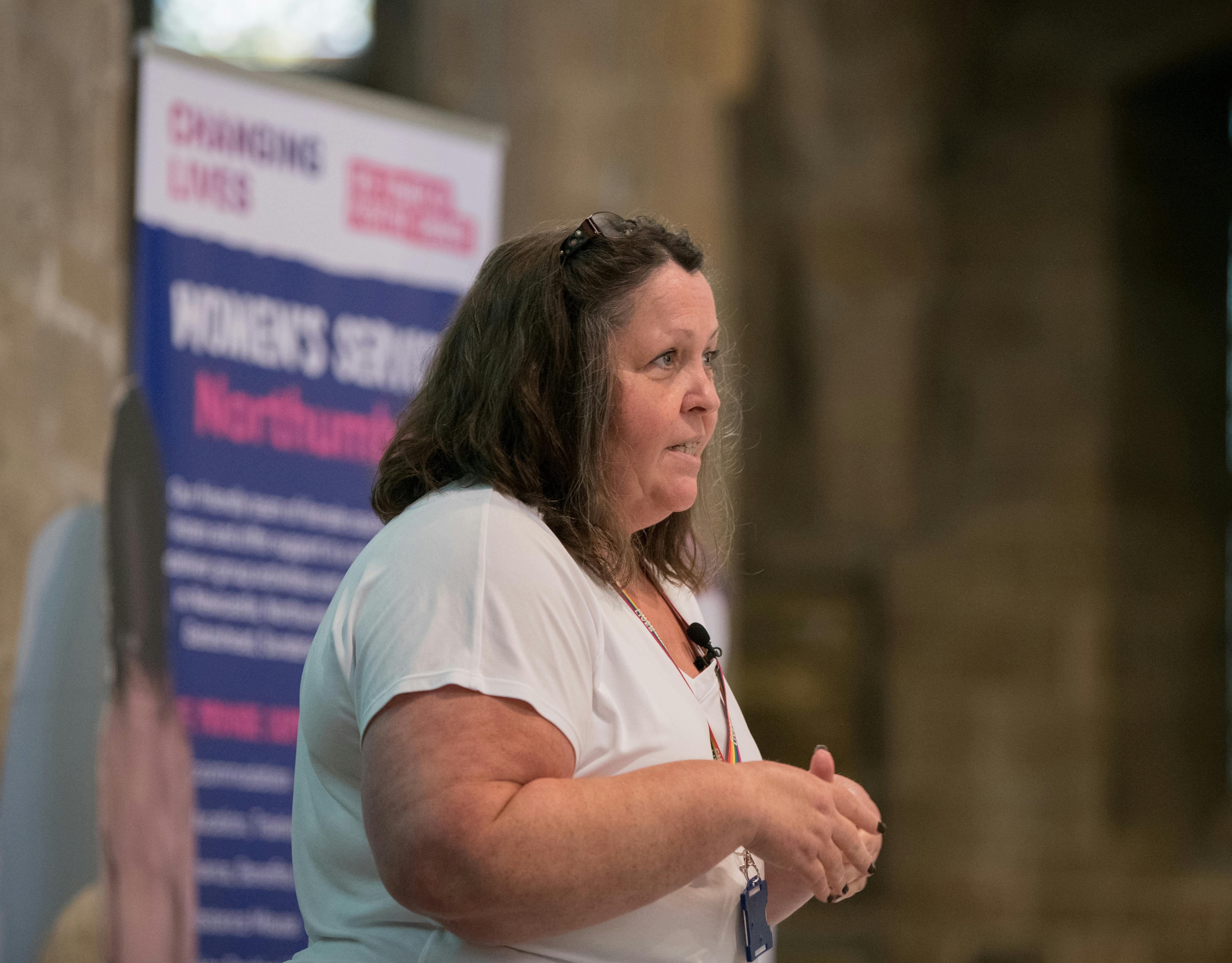 Changing Lives staff member giving talk at event.