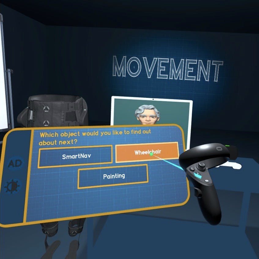 A blue tablet displaying the question “Which object would you like to find out about next?”, and a controller selecting “Wheelchair”. Behind them, an avatar on a laptop screen, and an exoskeleton model.