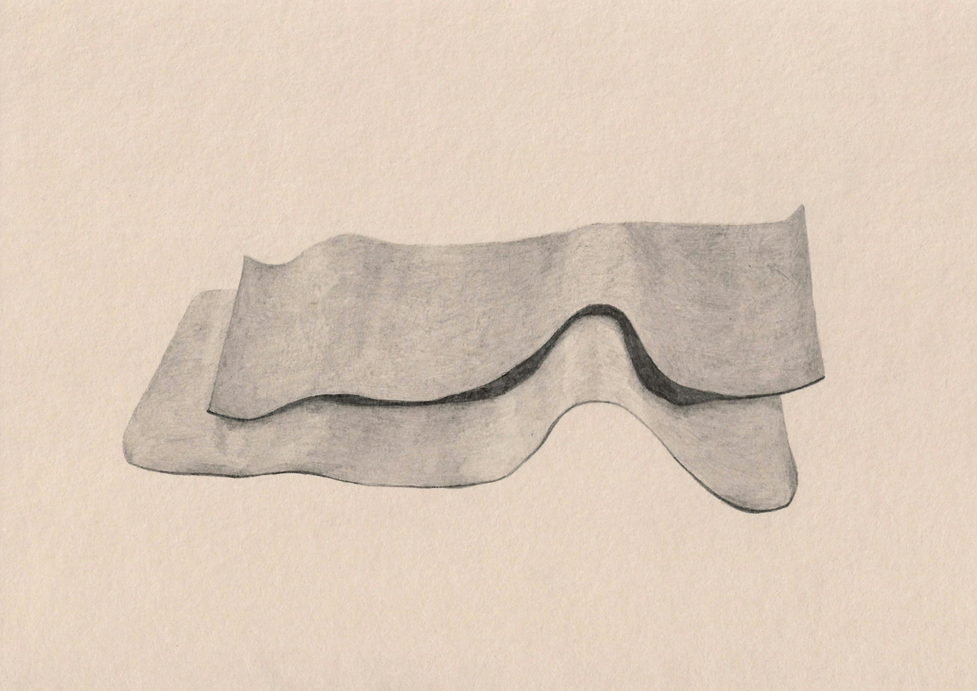 A pencil drawing on ivory coloured paper of two yoga mats crumpled up on the floor