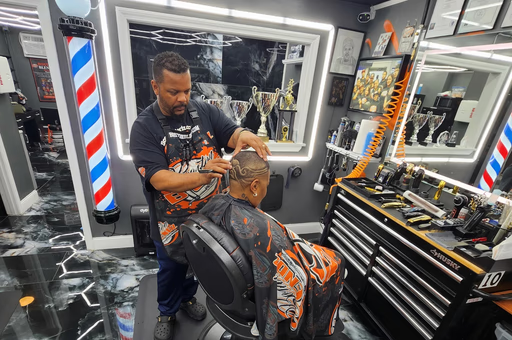 Photo of David owner of Boston Blendz cutting hair
