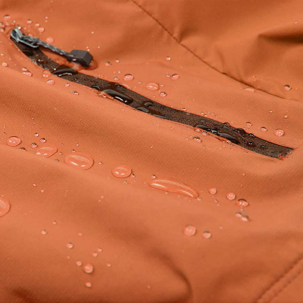Orange jacket close-up with water beading