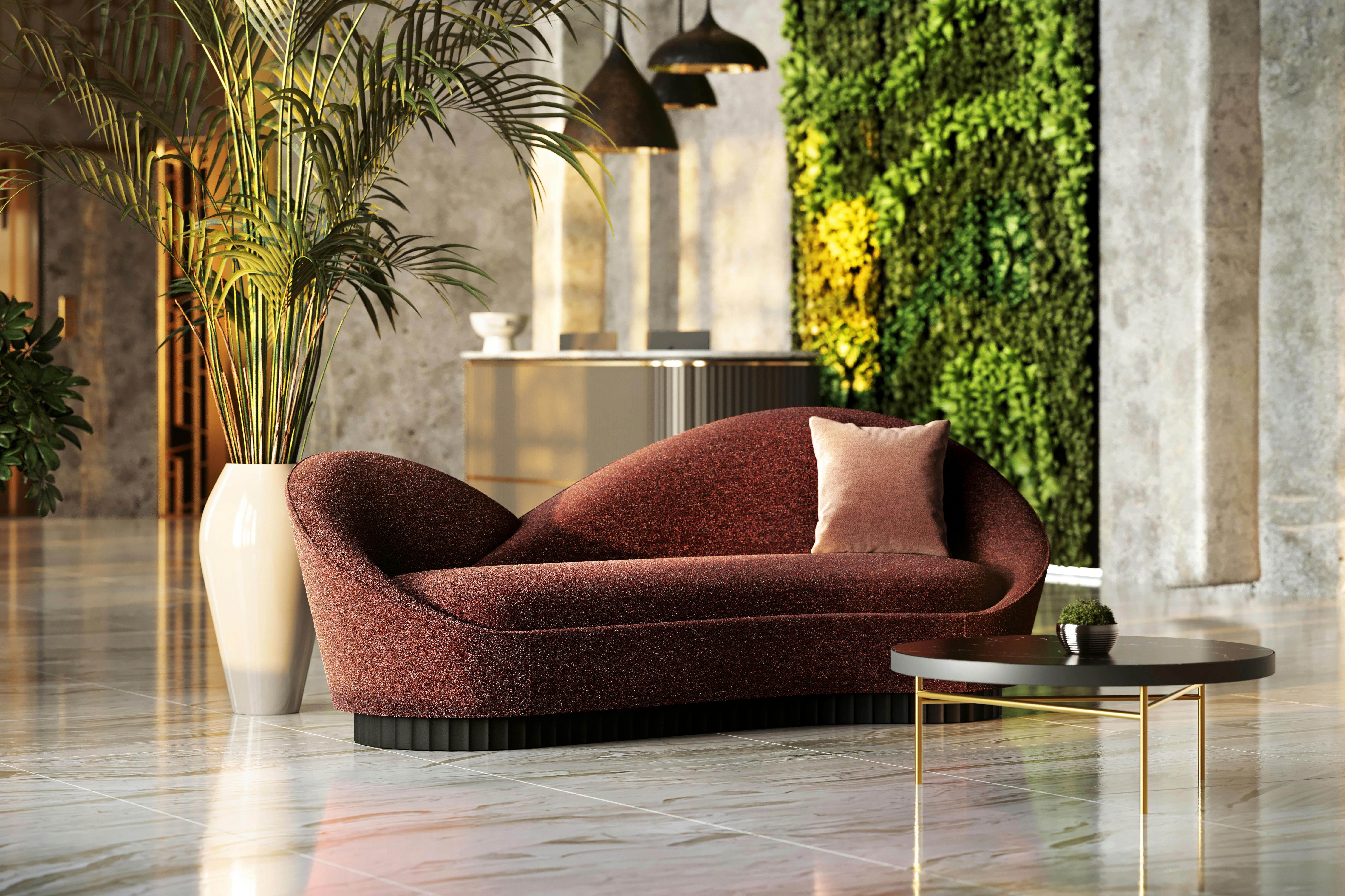 Stylish hotel lobby with custom seating and greenery, showcasing high-end hospitality furniture ideal for resort spaces.