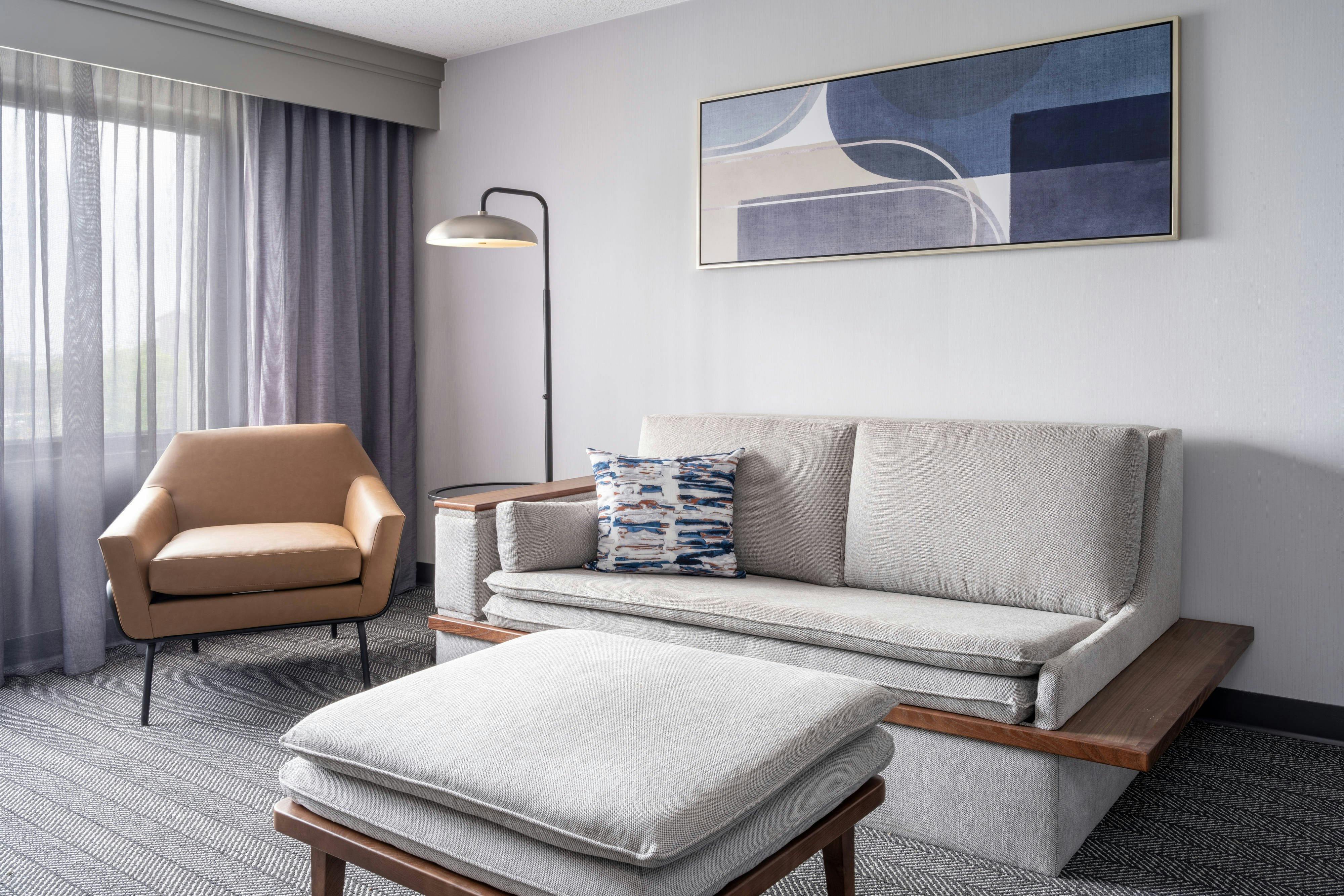 Hotel guestroom with customized furniture, perfect for multi-property resort installations, highlighting modern design and luxury