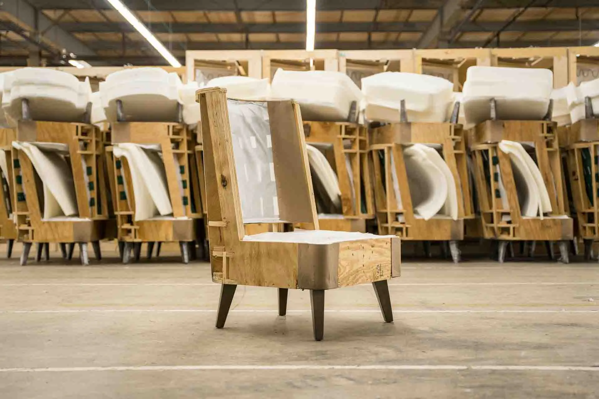 Manufacturing image of custom hospitality furniture being built.