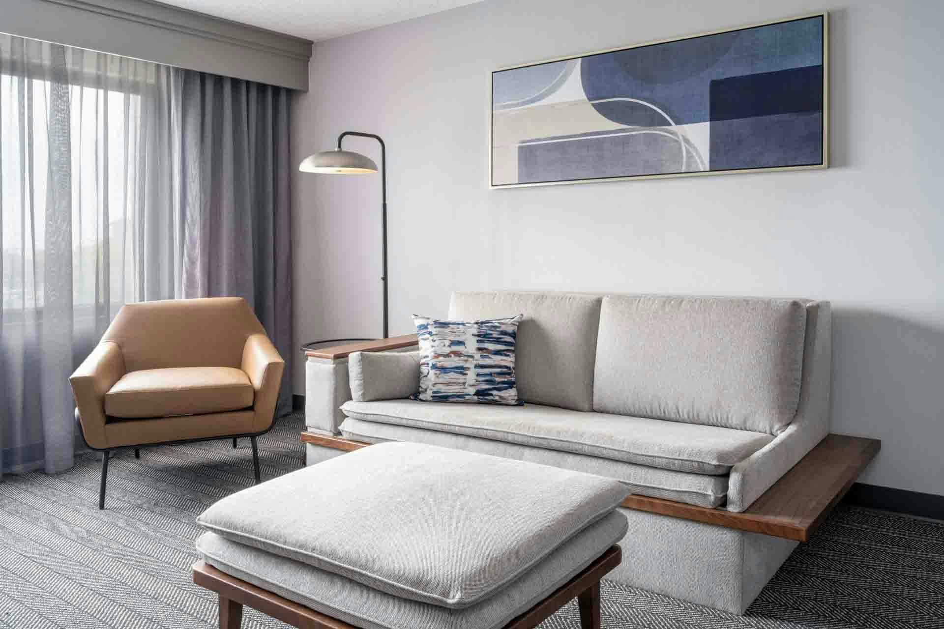 Hotel guestroom with customized furniture, perfect for multi-property resort installations, highlighting modern design and luxury