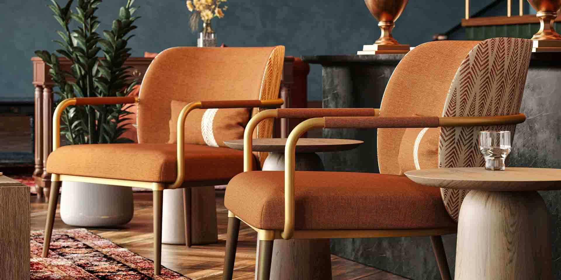 Closeup of custom hospitality lounge furniture setup featuring two armchairs.