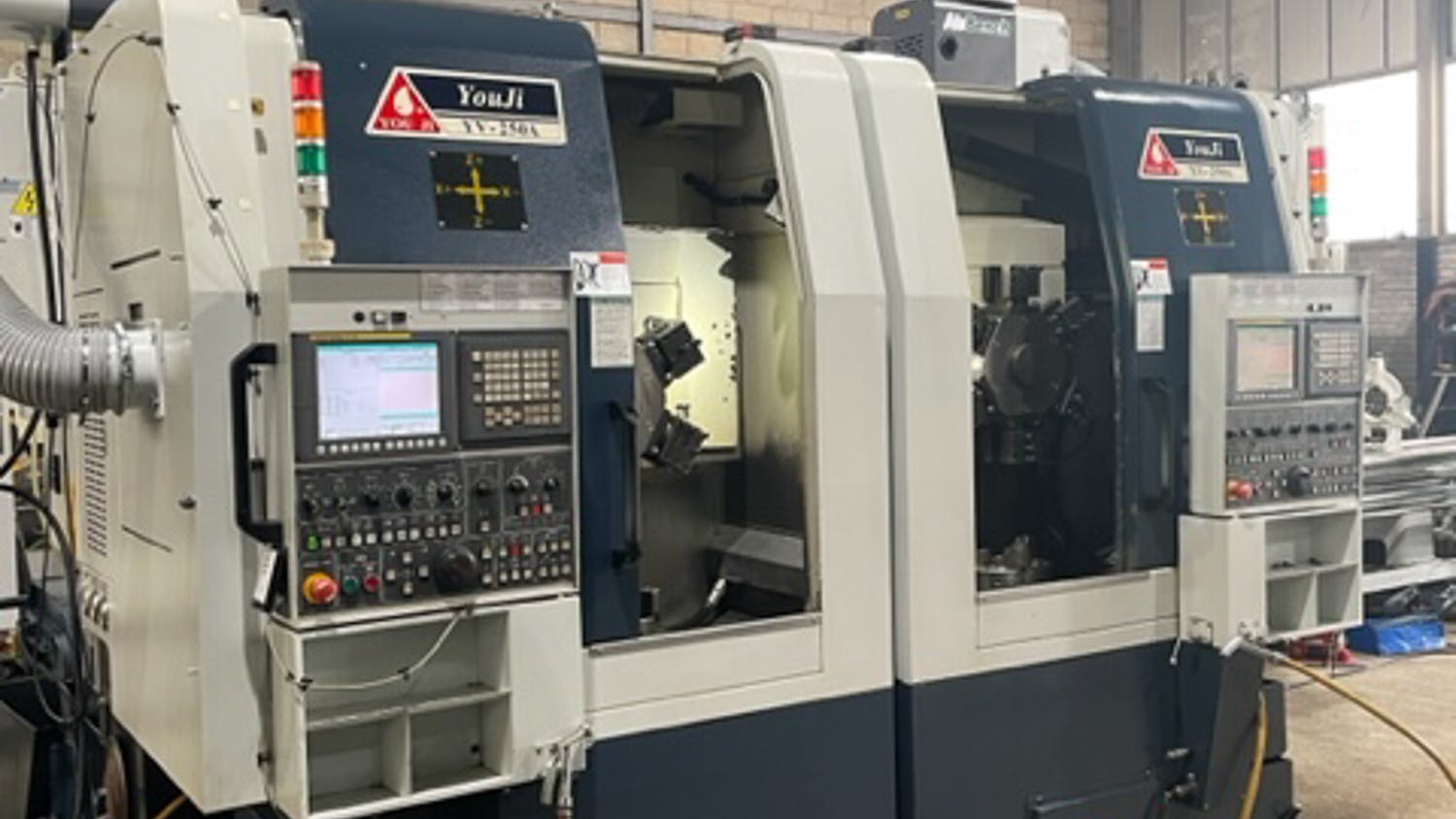 2 x YOU-JI YV250A CNC VTL Side-by-Side Vertical Turning Centre