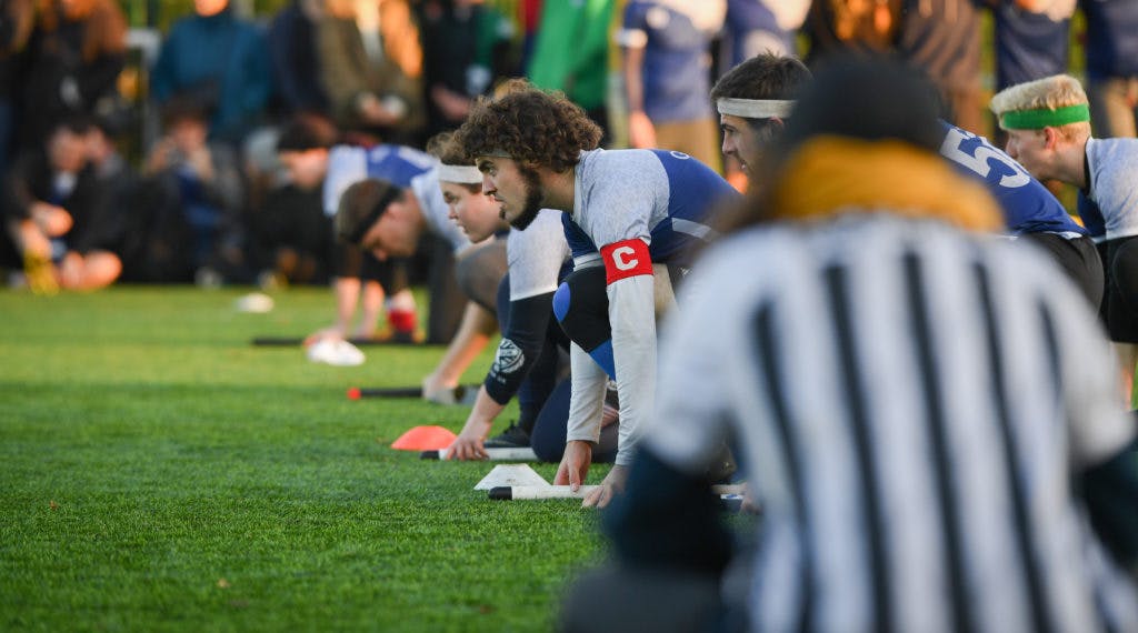 Players line up for a brooms up