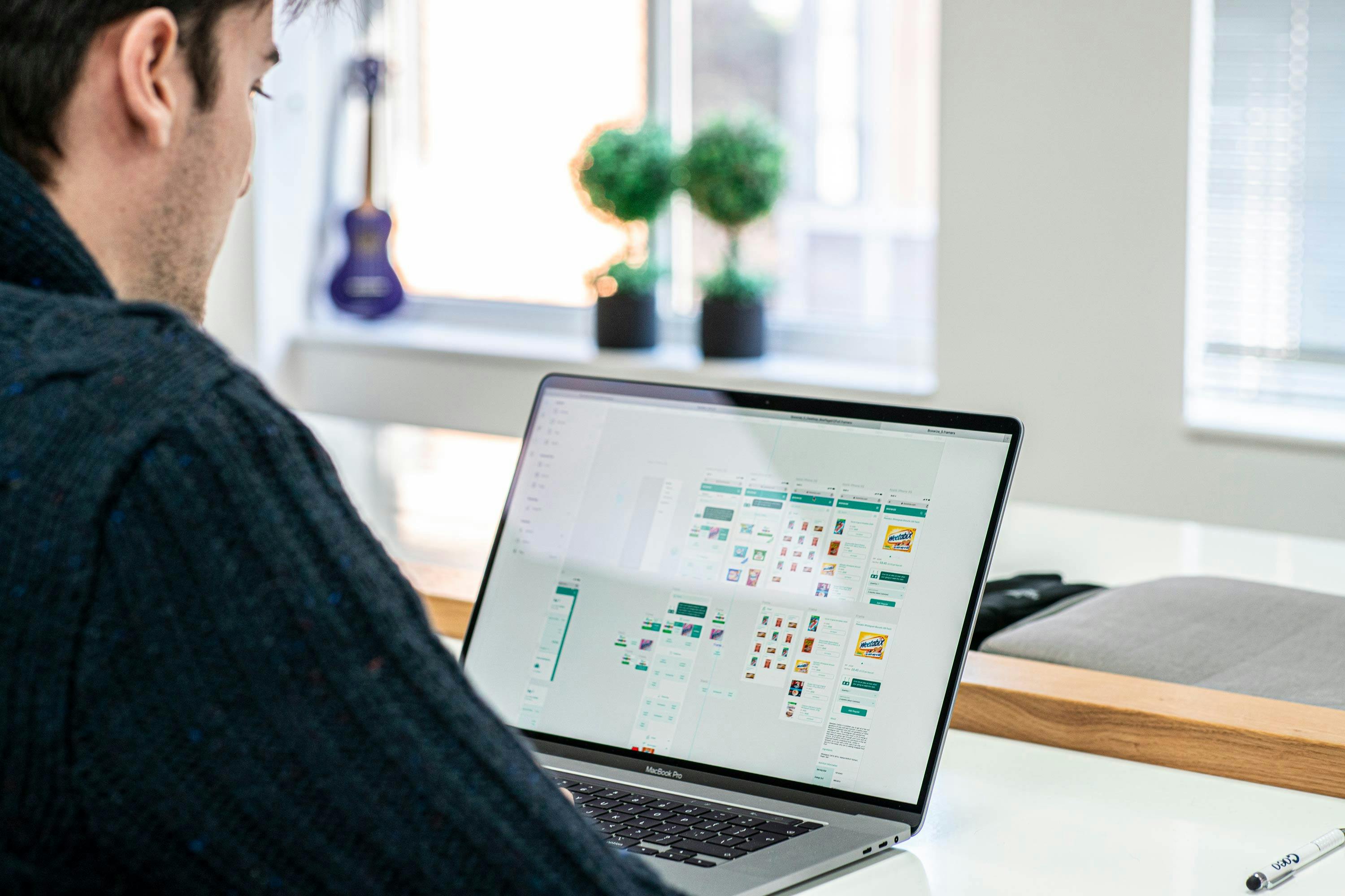 A Chelsea Apps designer working on Framer for UX/UI design