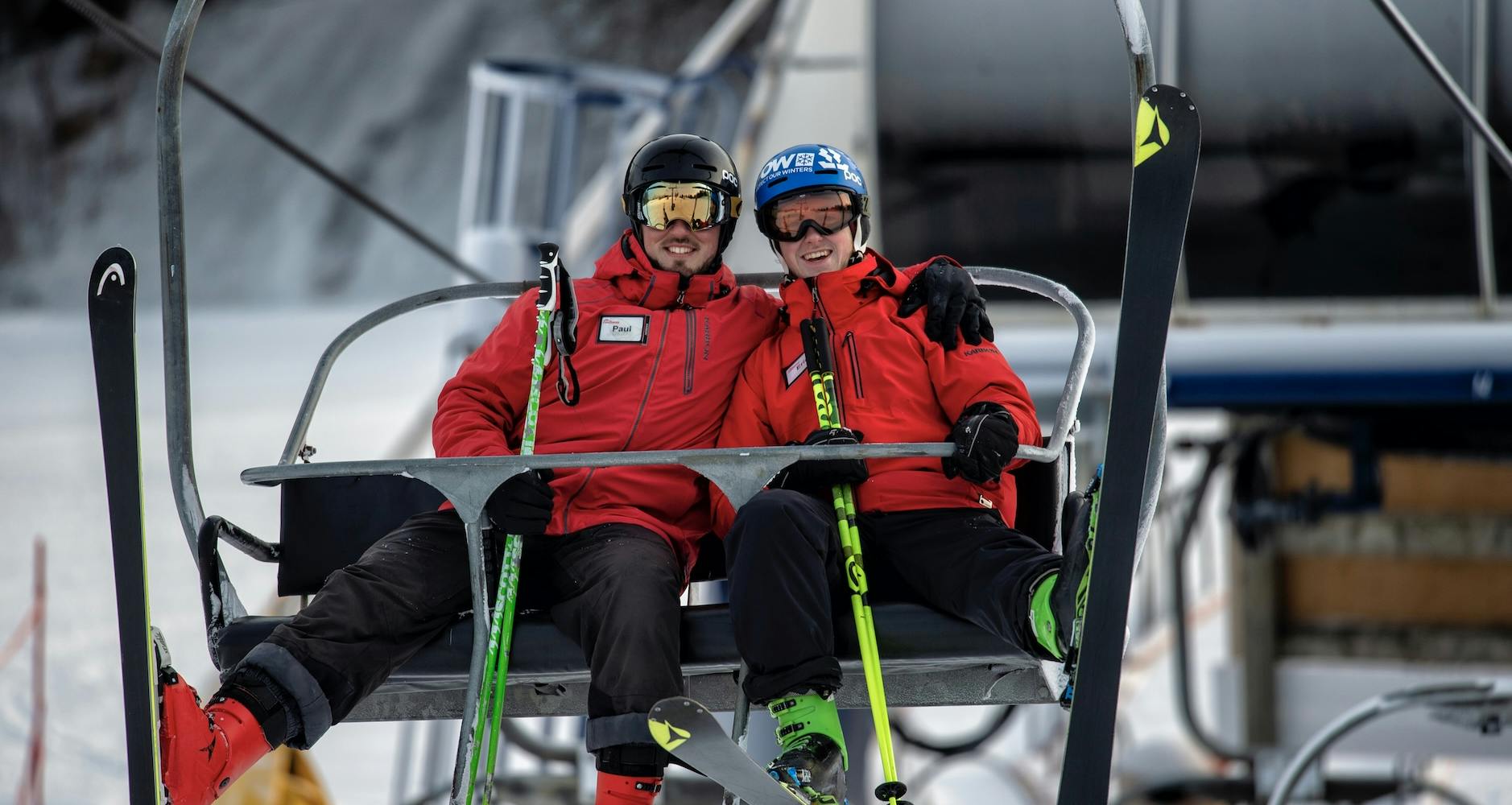 Two Chicopee ski instructors riding the chairlift together. 
