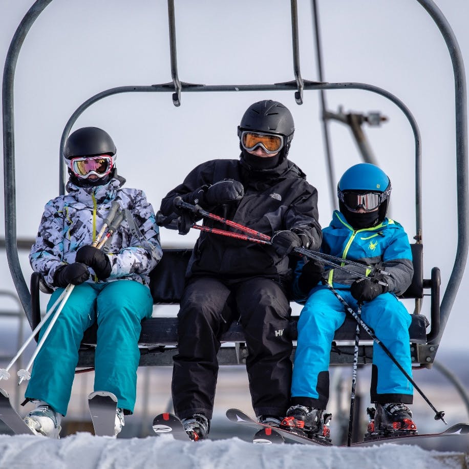 Family on the ski lift going up
