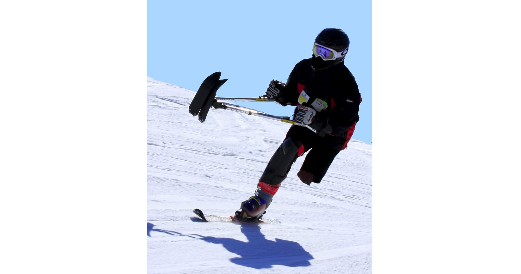 One-legged Track-3 skier showcasing their skiing skills. 