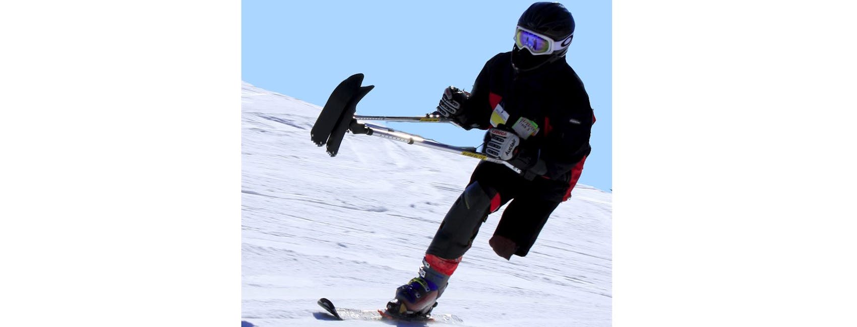 One-legged Track-3 skier showcasing their skiing skills. 