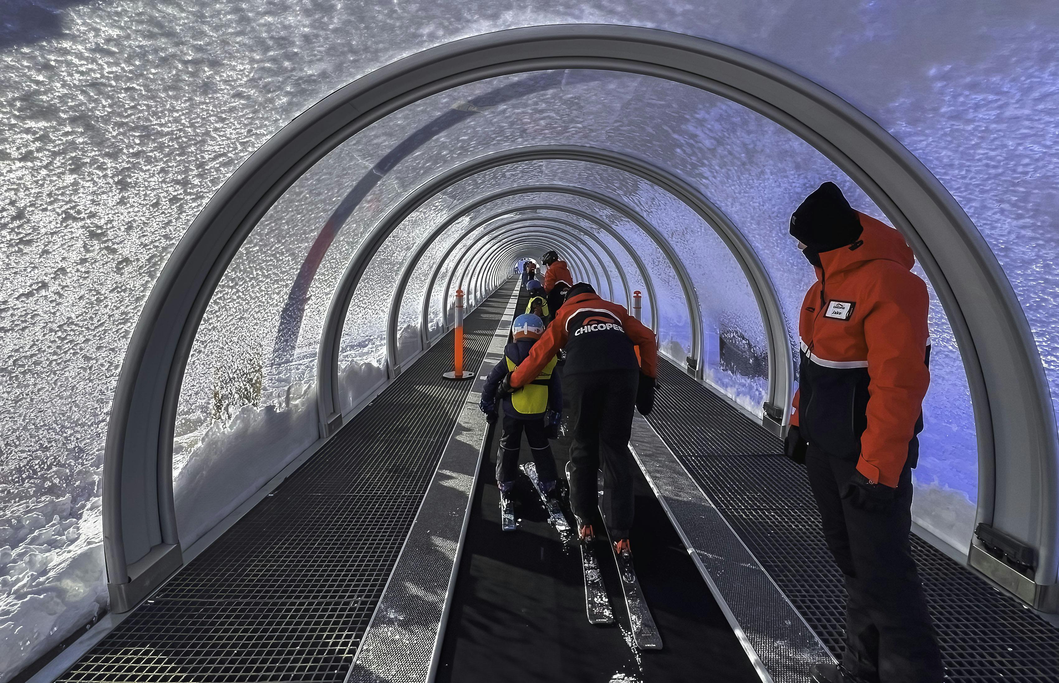 Instructor and student on Surface Lift 1 with Lift Operator in frame.