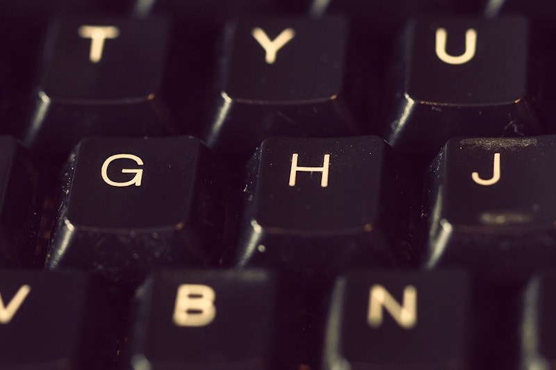 A close up image of a black Qwerty keyboard 