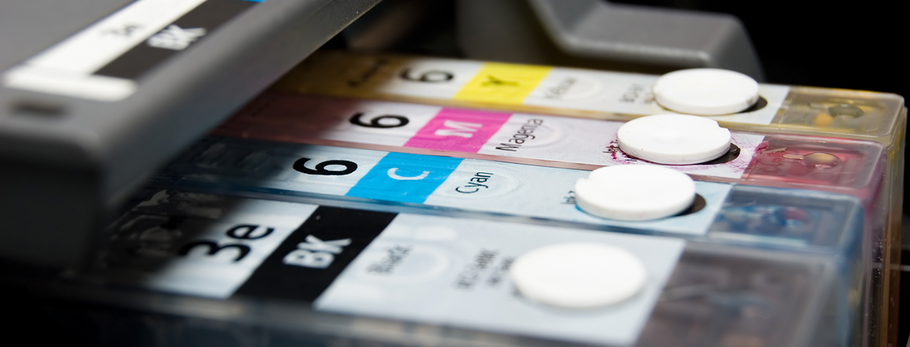 An inkjet printer cartridges showing Black, Cyan, Magenta and Yellow