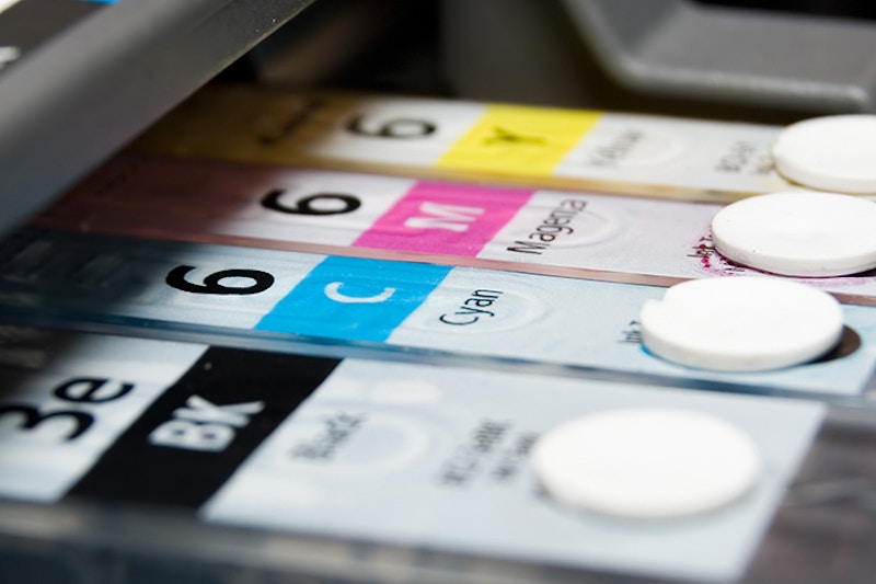 An inkjet printer cartridges showing Black, Cyan, Magenta and Yellow