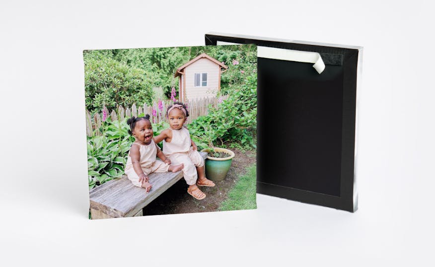 peel and stick photo tile showing two little girls sitting on bench in garden