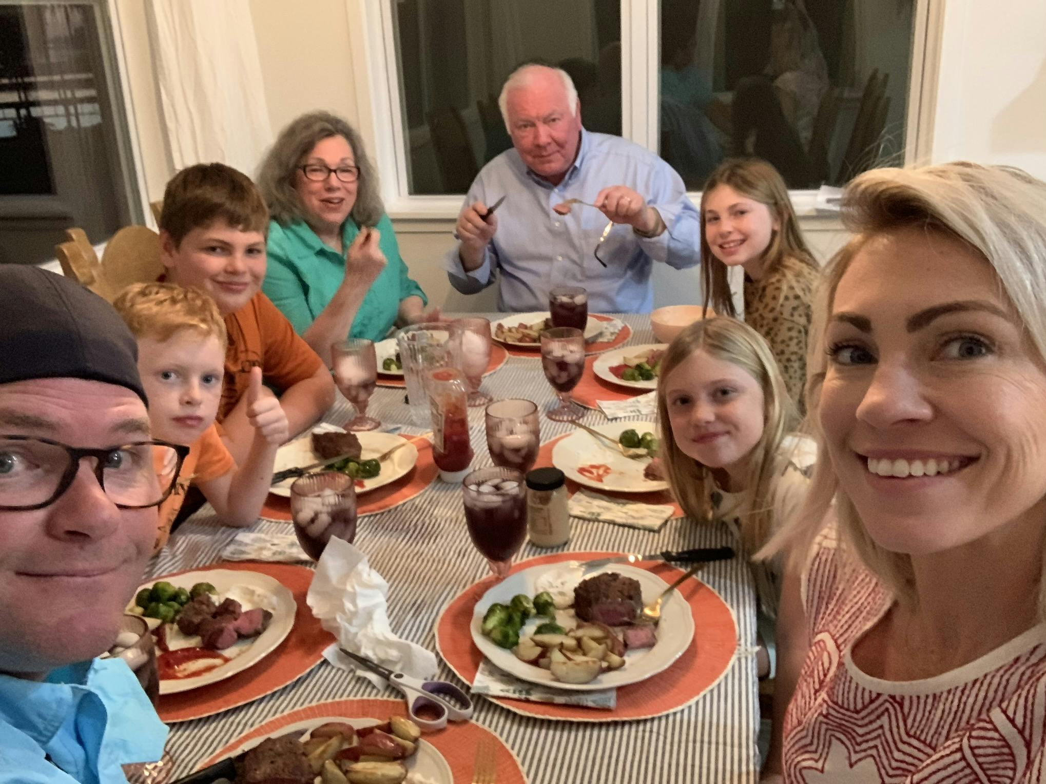 family eating dinner together at night.