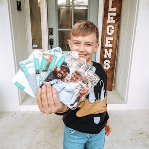 little boy holding monthly minis