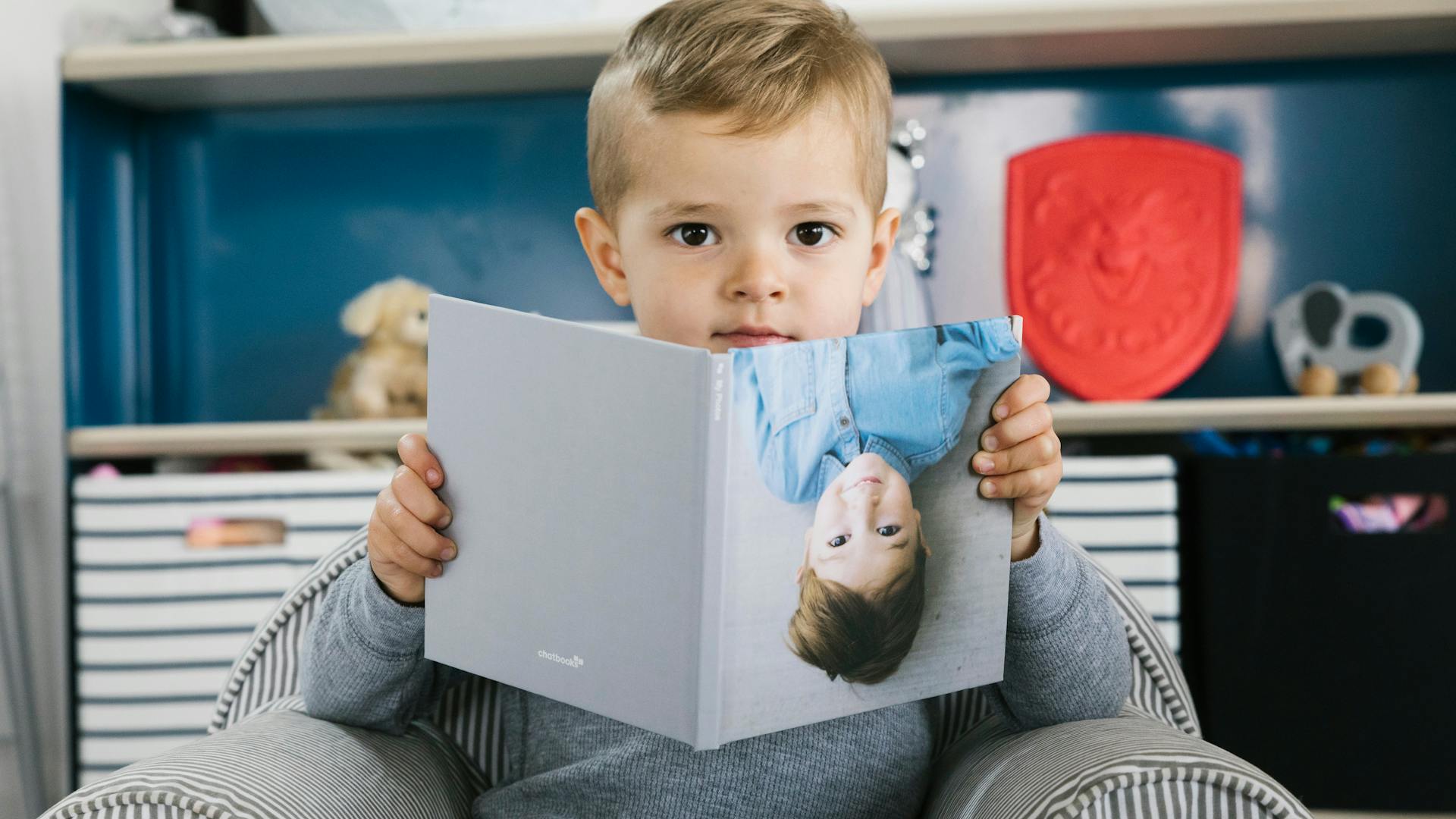 Boy with Chatbooks photo book