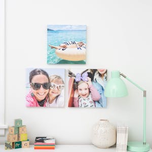 3 family wall tiles hanging above a white dresser in a little girl’s bedroom