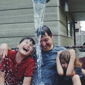 Dad with children in water