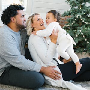 Family around Christmas tree