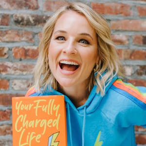 Meaghan B Murphy holding her new book and smiling