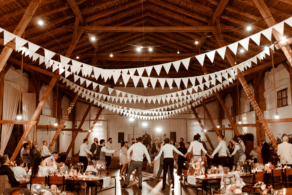 People dance in the background.