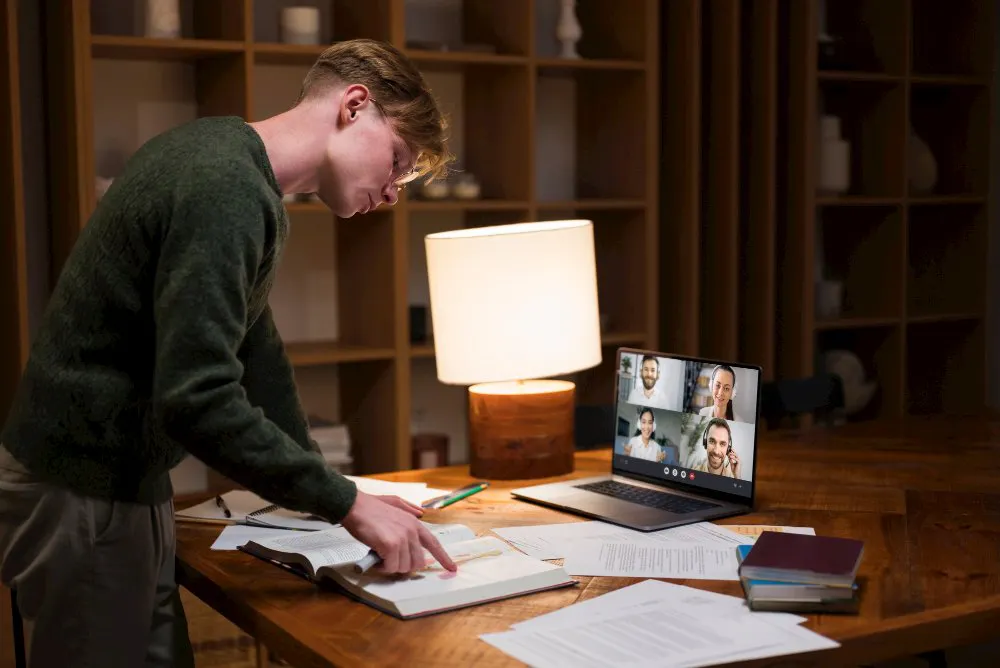 Learner reviewing course notes during an online video lesson