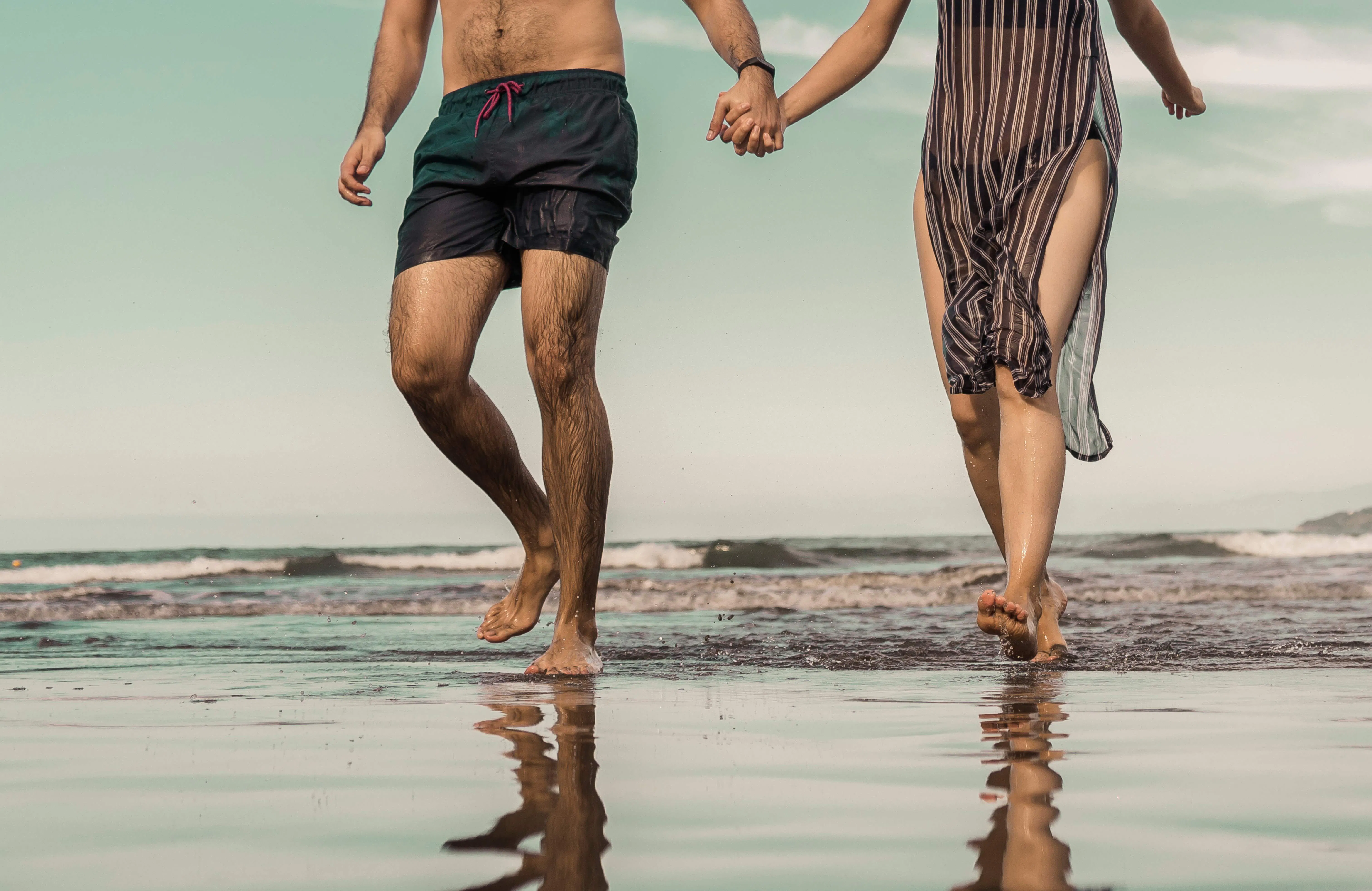 couple at the Fort Lauderdale beach holding hands