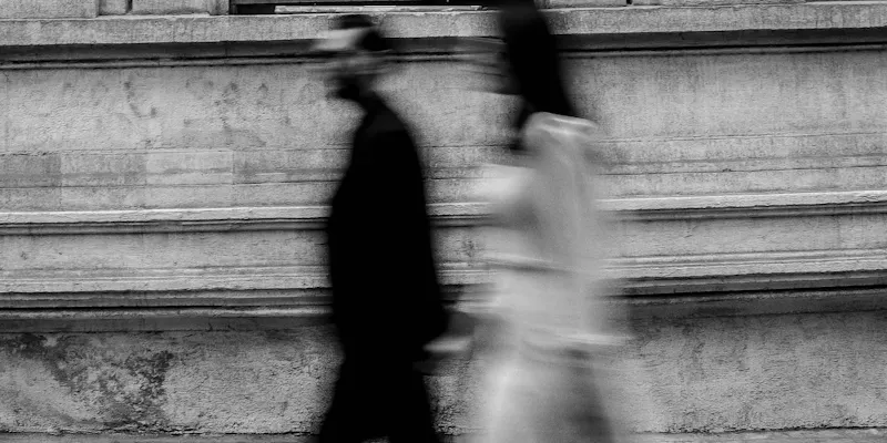 couple walking blurry