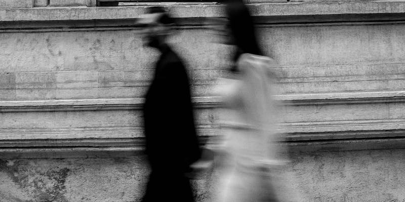 couple walking blurry