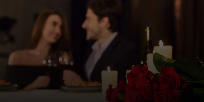 couple smiling at dinner in New York City