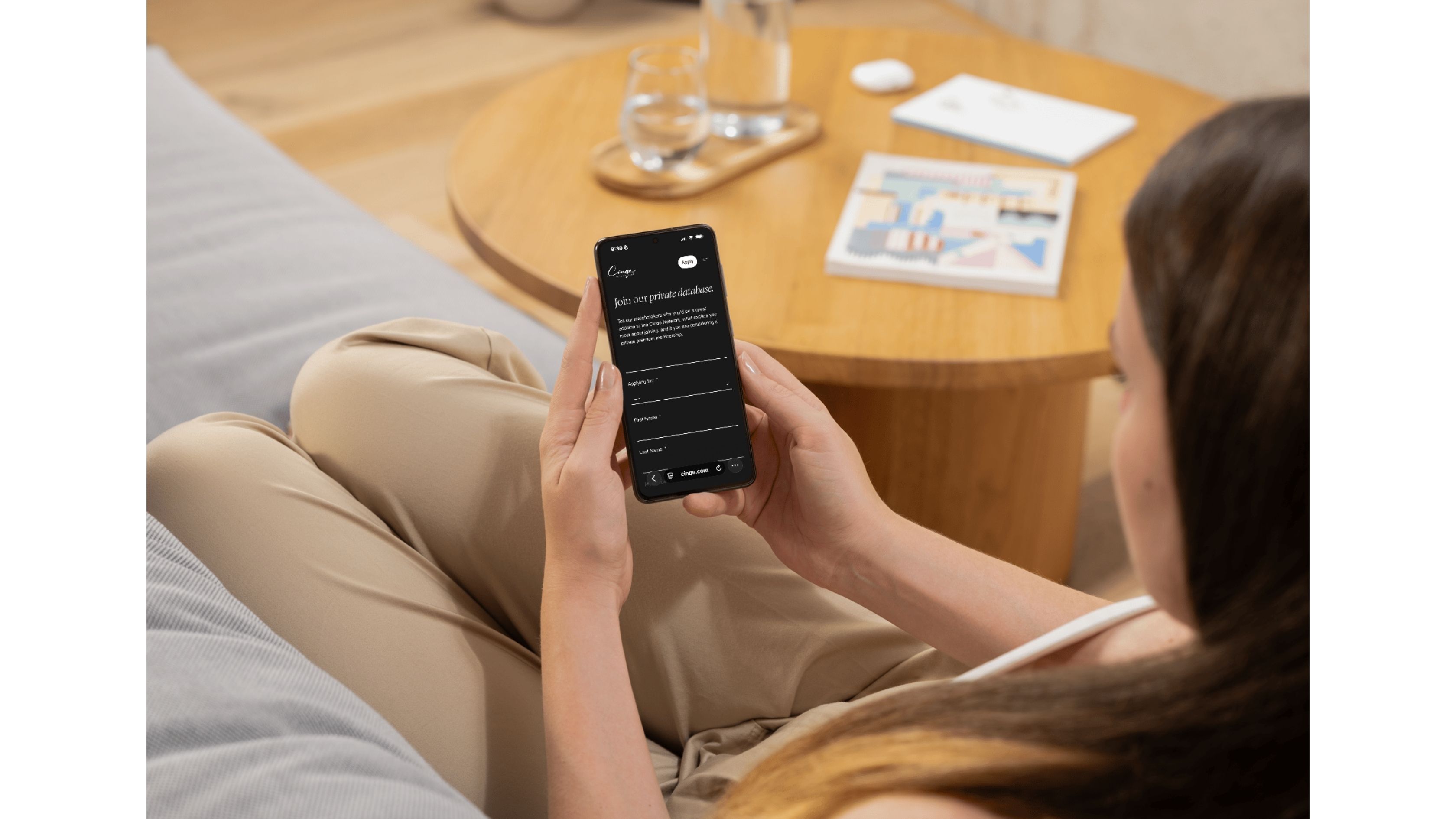 girl holding phone to join Cinqe Matchmaking services
