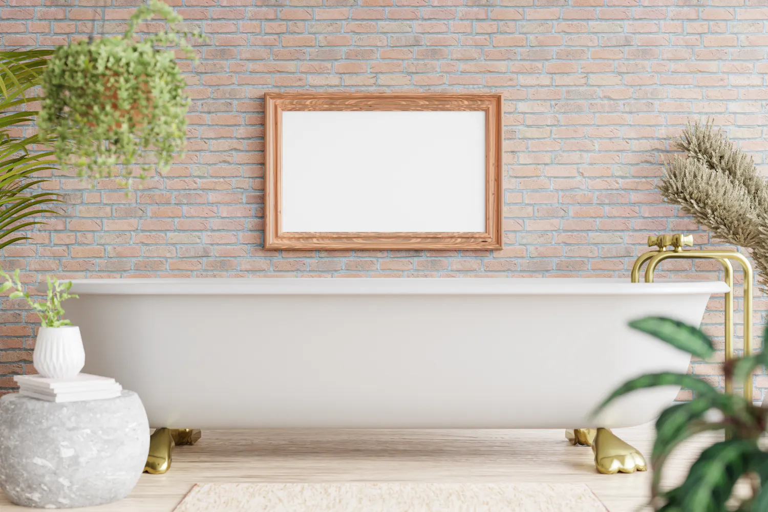 Bain blanc sur pieds en laiton dans une salle de bain avec des plantes et un mur en pierres.