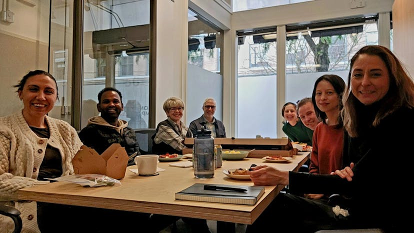 The CIRES team gathered around a table 