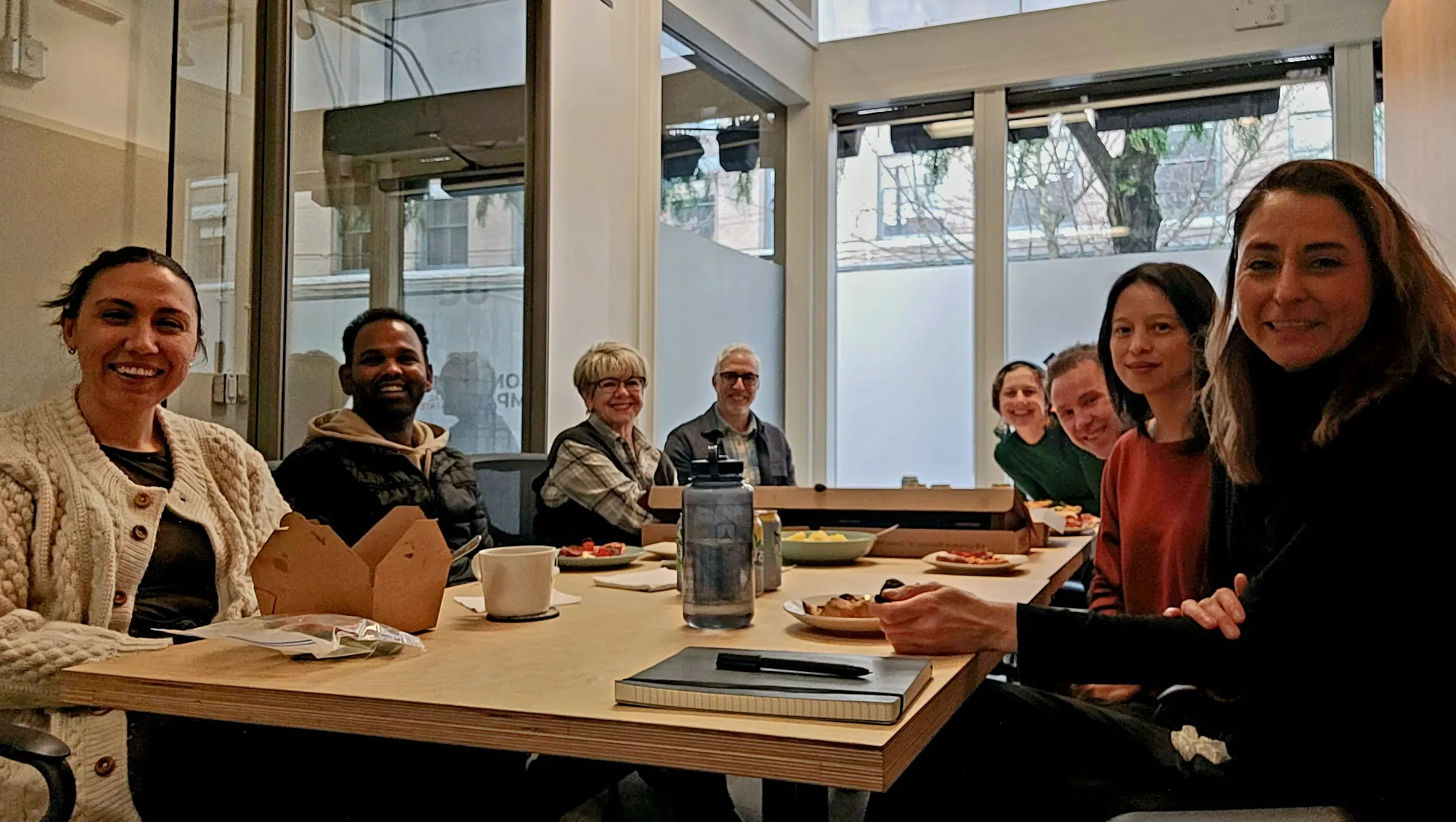 The CIRES team gathered around a table