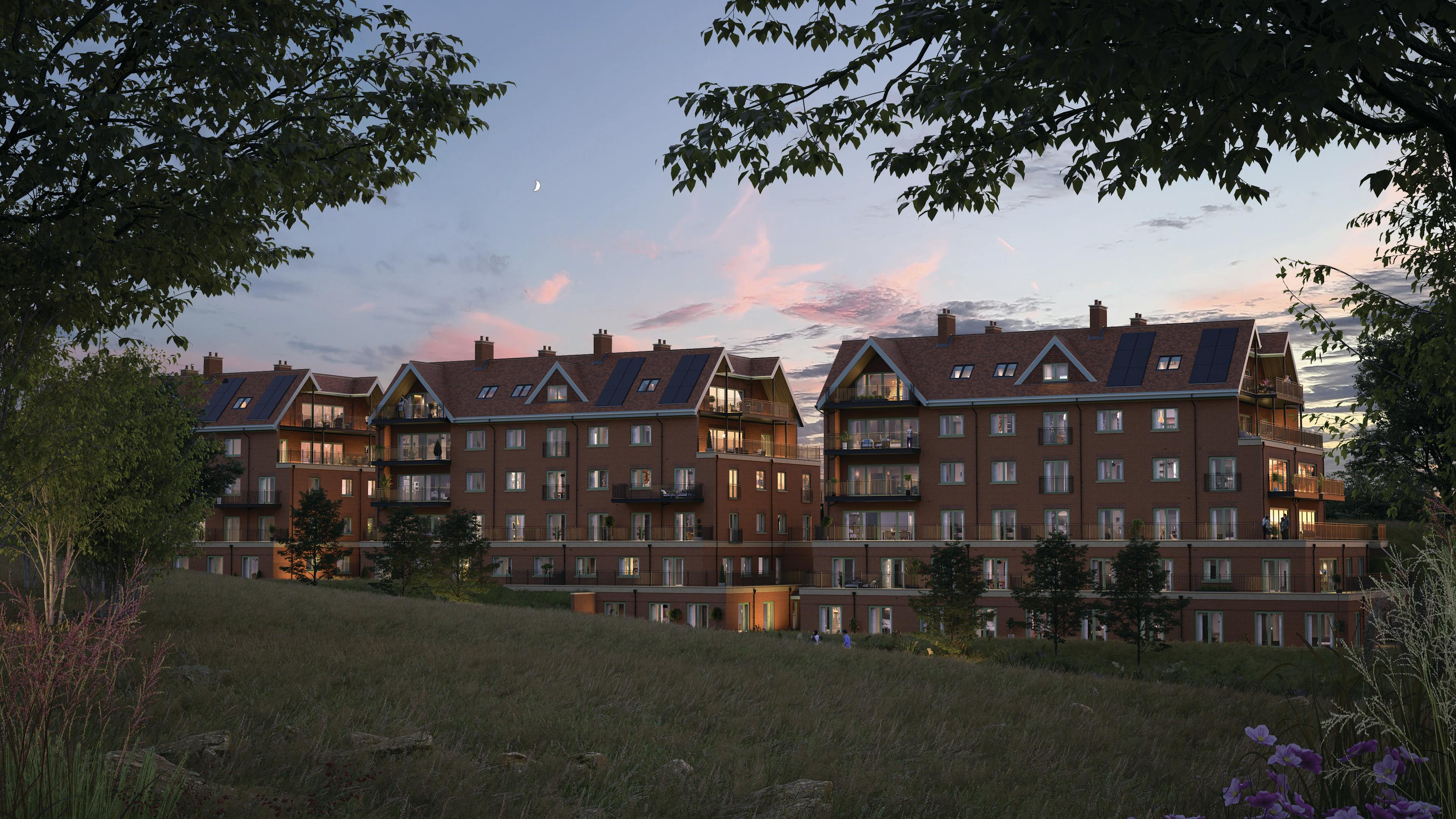 Caption: a group of buildings sitting on top of a lush green hillside