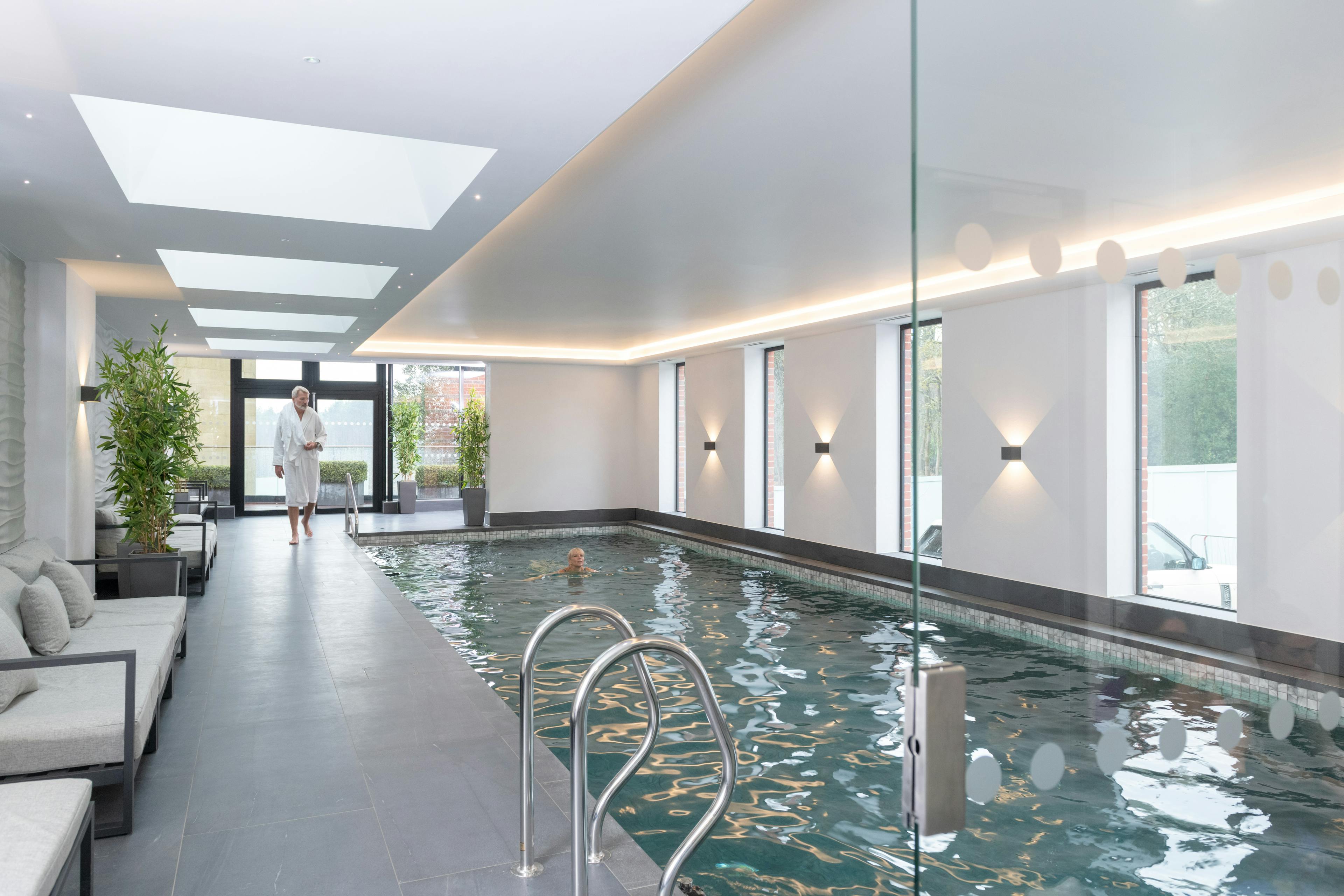 Caption: a large indoor swimming pool in a house