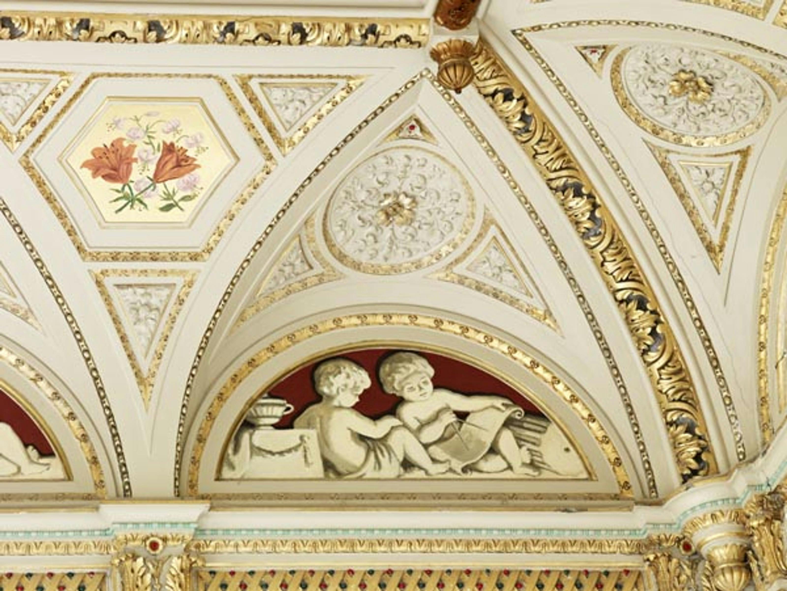 Caption: a close up of a decorative ceiling in a building