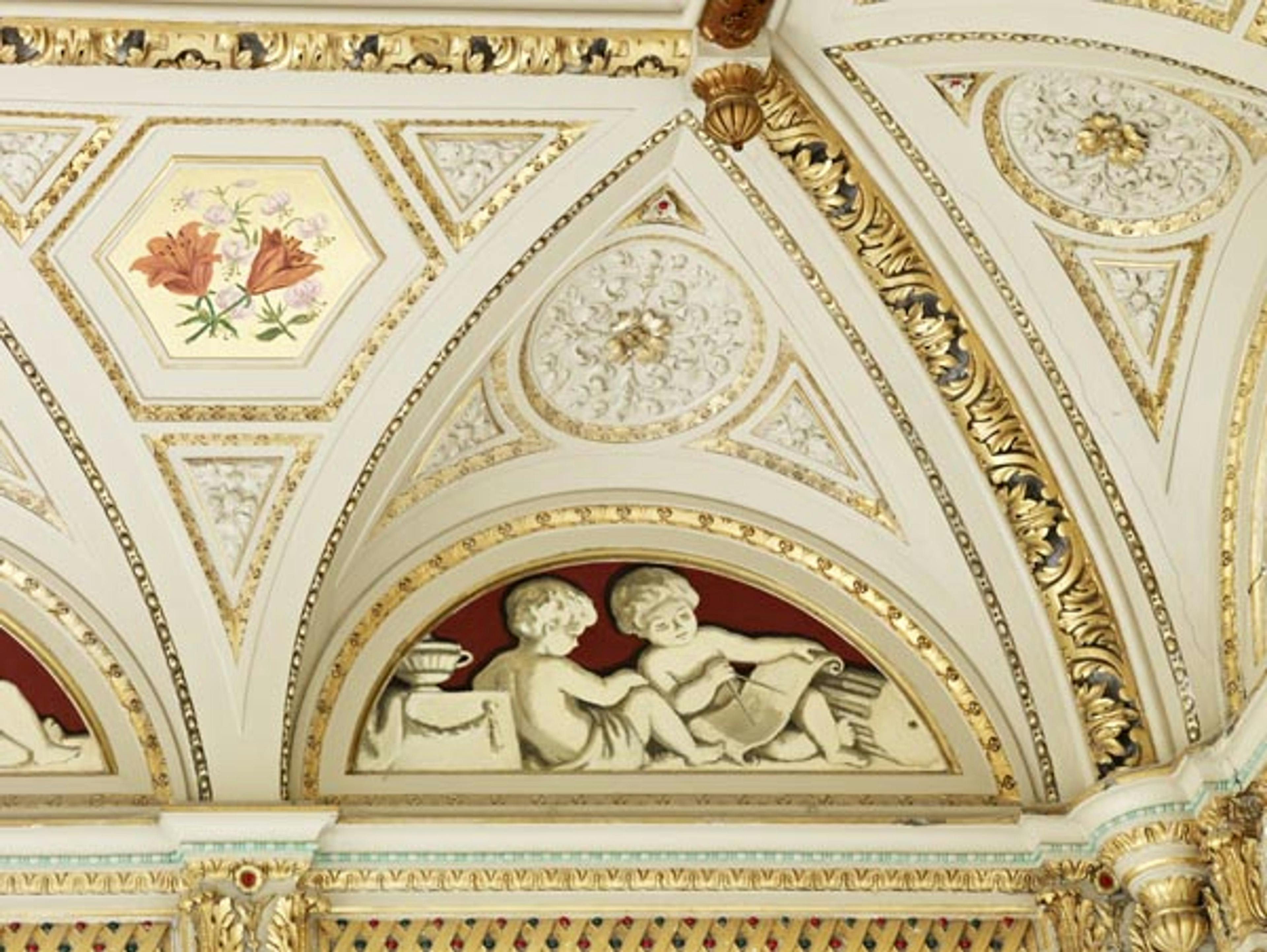 Caption: a close up of a decorative ceiling in a building