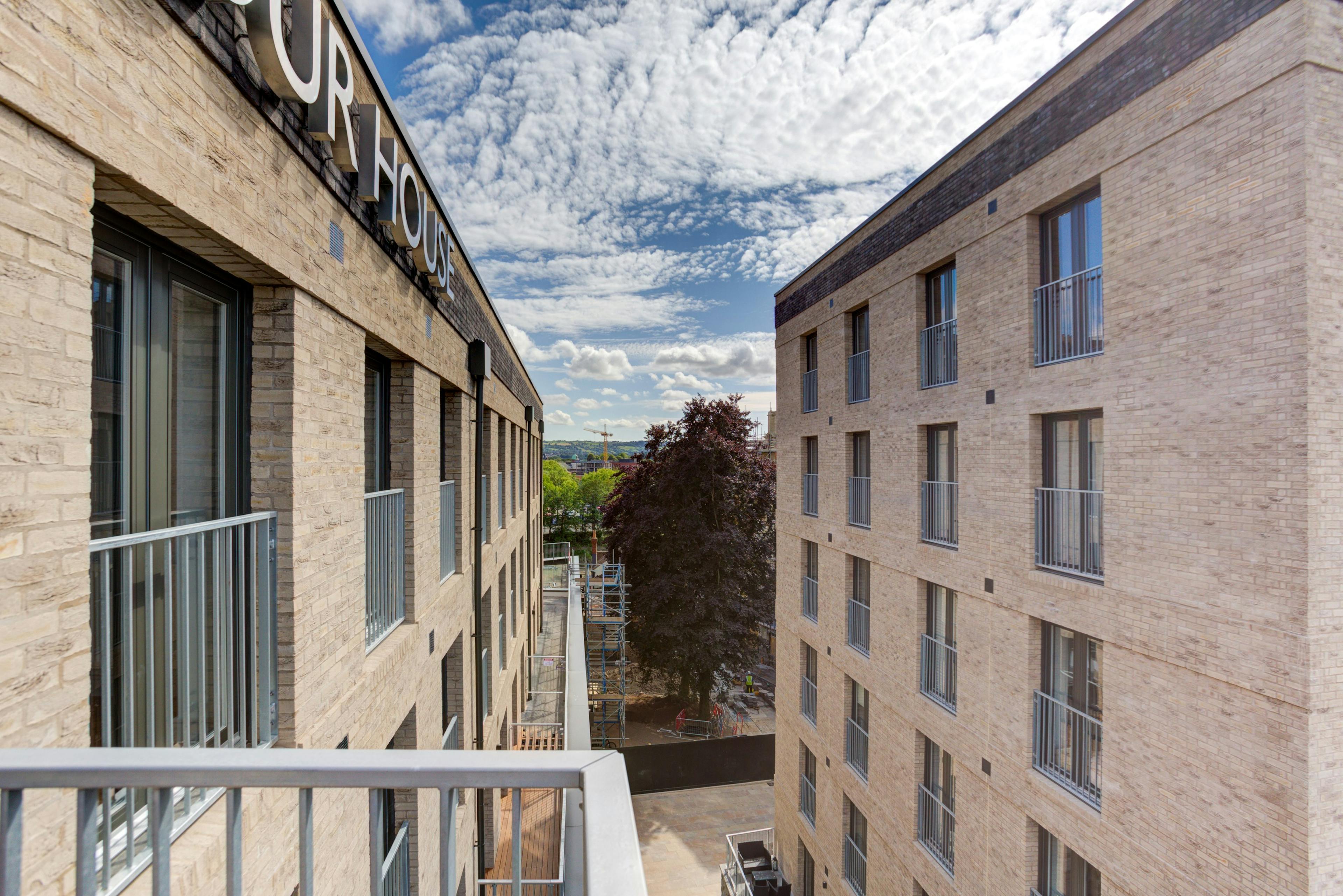 Caption: a view of a building from a balcony
