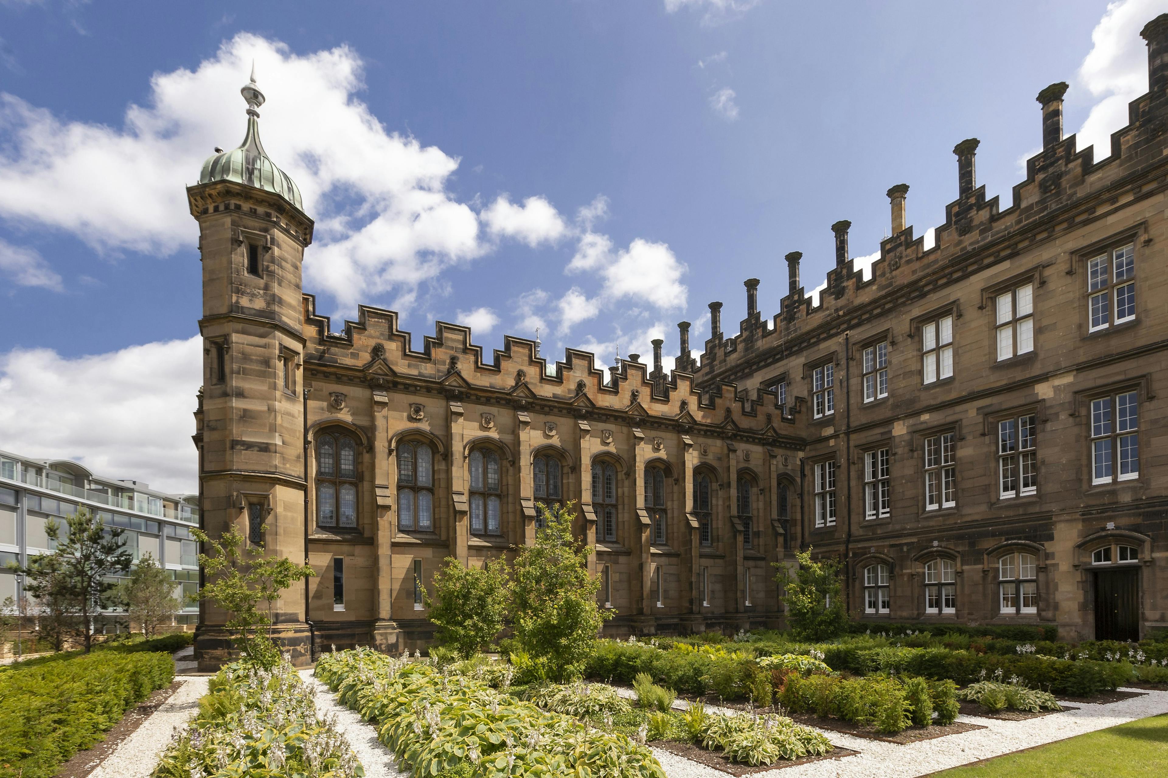 Caption: a large building with a clock tower on top of it