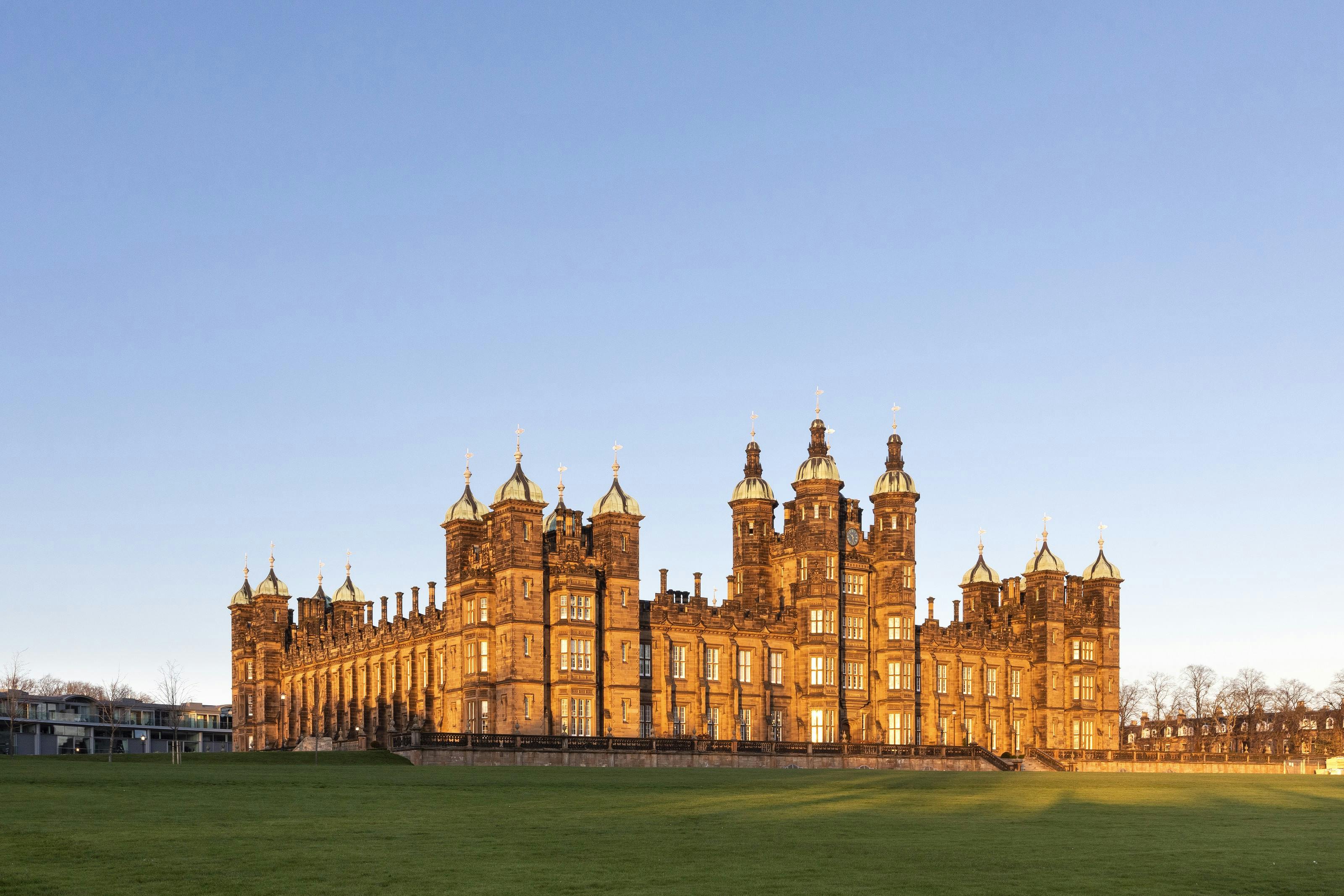 Caption: a large building with a clock tower on top of it
